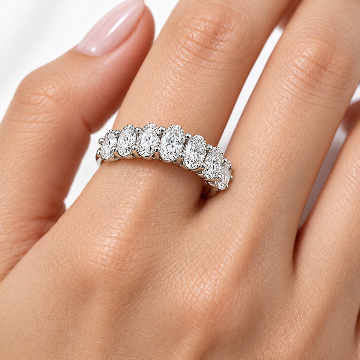 Seven Oval-Cut Synthetic Diamond Half-Eternity Ring in Sterling Silver